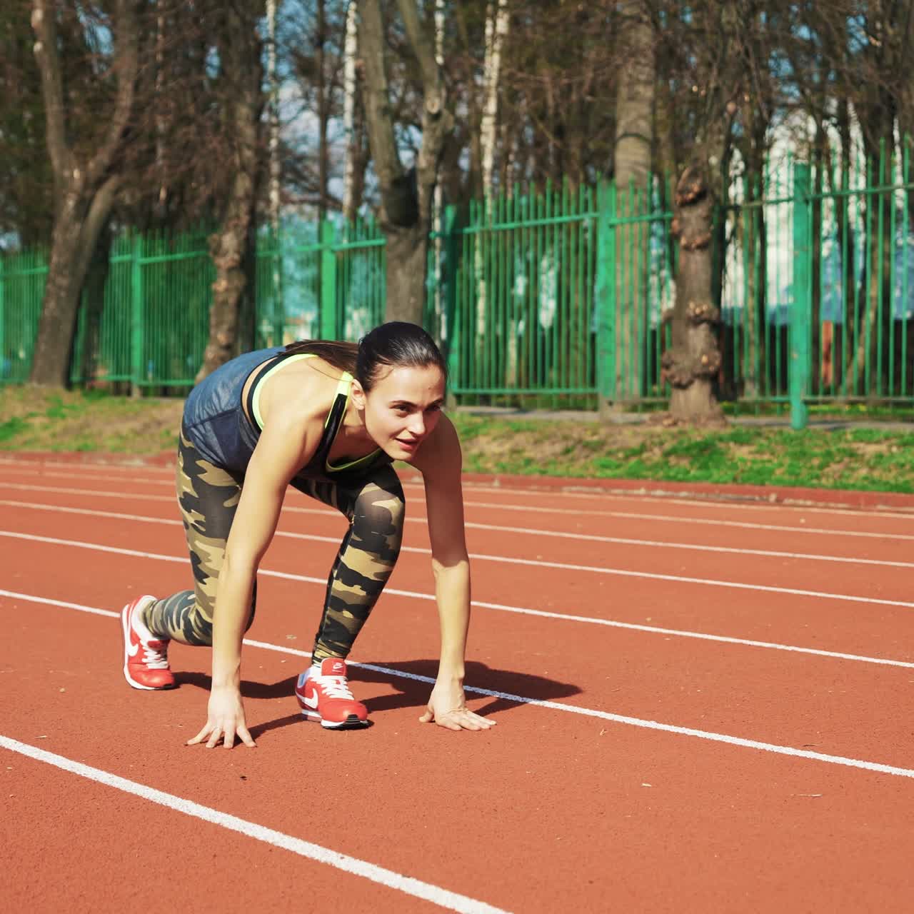 Sport reaction video Athletes at starting position preparing for run at the stadium. Healthy fitness lifestyle