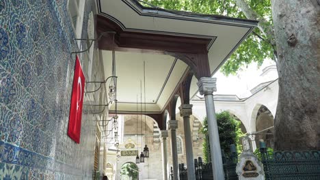 a mosque in turkey with a red flag on the wall