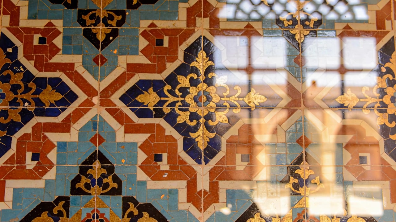 Catching brightening window light, tile panel reflecting faint figure in glossy glass at palace
