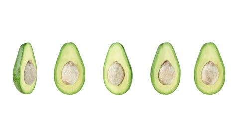 funny motion of many halfs avocados close-up on a white background. seamless looping animation with copy space