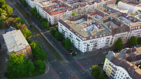 overview of prenzlauer berg allee with television tower multi-family houses amazing aerial view flight tilt down drone footage
of berlin summer 2022