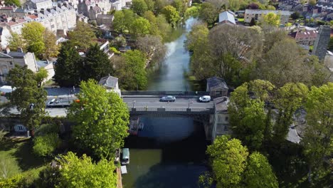 Aerial-of-a-traffic-laden-road-bridge-in-the-centre-of-a-beautiful-and-historical-quaint-english-town