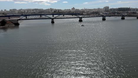 aerial view of bridge over river dolly-in