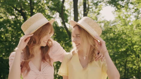 two happy young women in a park