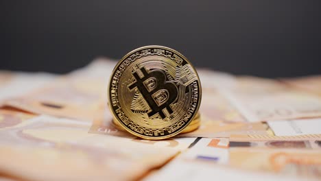 bitcoin coin standing on euro cash, dramatic light change adds modern finance feel