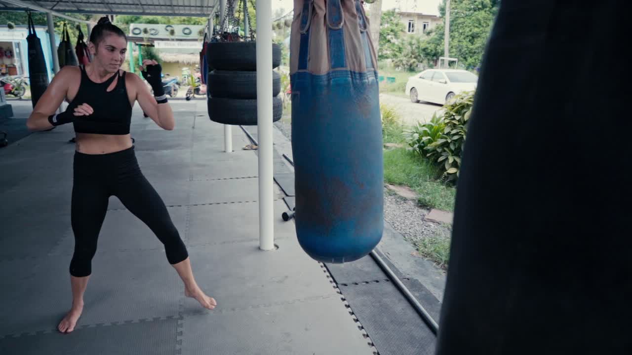 Woman Training Muay Thai at Outdoor Gym