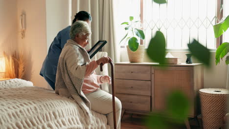 a caregiver comforting an elderly woman in a hospital bed