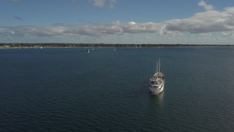 Aerial-view-of-white-coastal-freight-vessel-moored