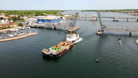 Coast-Guard-Cutter-Bristol-Bay-WTGB-102-Going-Through-Bridge-Leaving-Sturgeon-Bay,-Wisconsin-to-Set-Summer-Bouy's