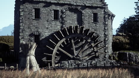 old stone watermill in a rural landscape