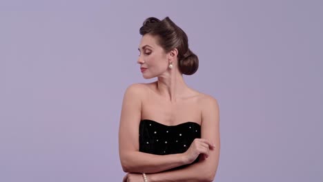 elegant woman in black dress posing with various expressions in a studio