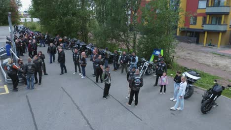 large group of bikers meeting outdoors