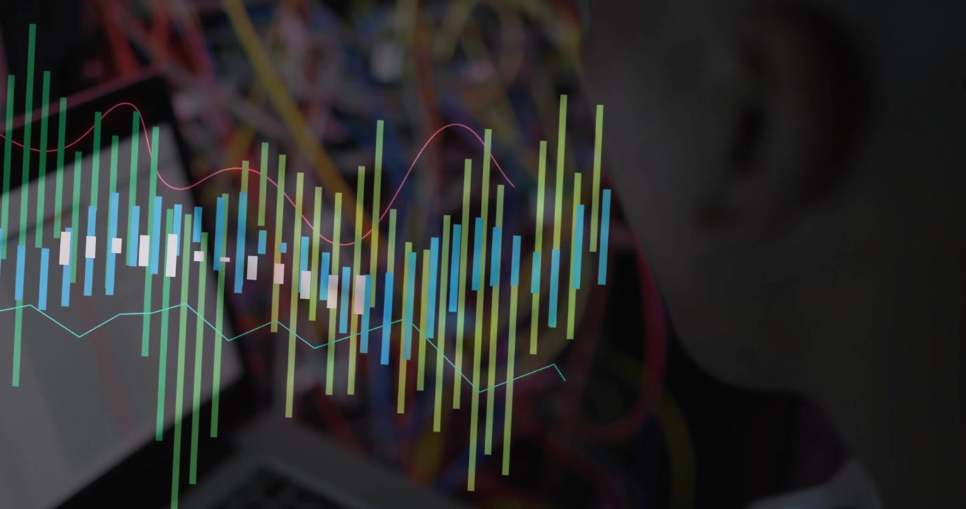 Network engineer typing on laptop, generating data bars and red waveform monitoring network traffic