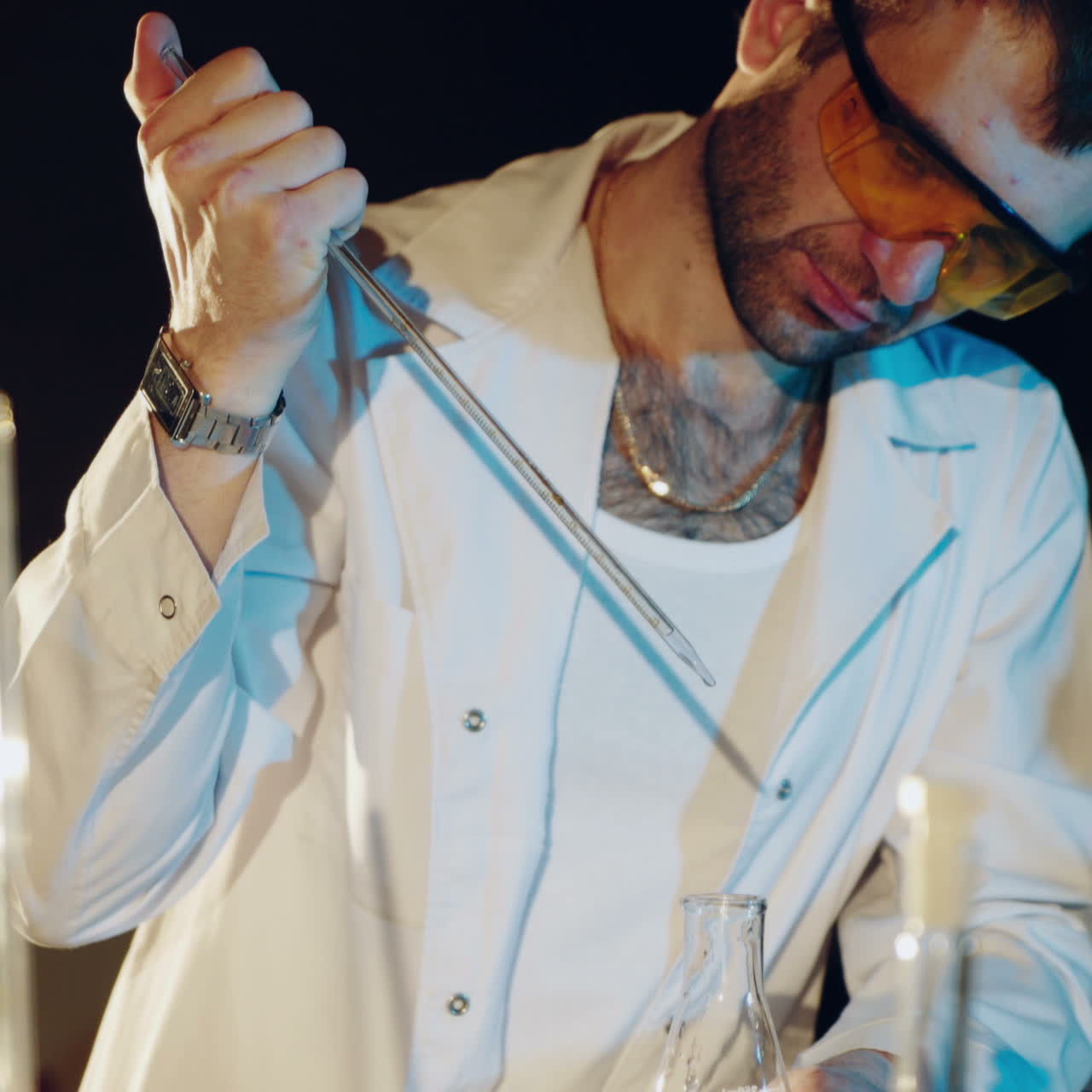 Lab technician scientist performs medical clinic chemical analysis and diagnostics using test tube phial and pipette. Square video