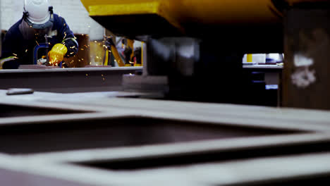 male engineer using welding torch in workshop 4k