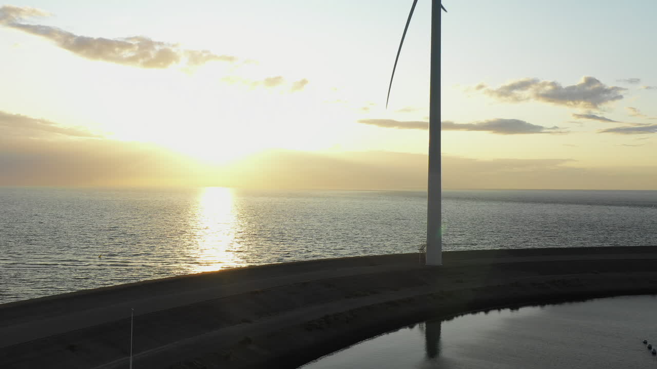 Windturbines during sunset on the island Neeltje Jans, the Netherlands. Aerial shot
