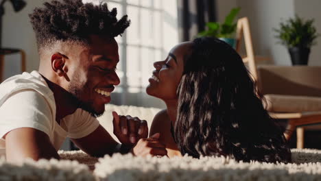 happy black couple sharing intimate and joyful moments at home