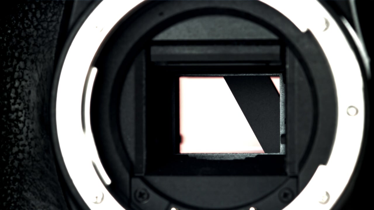 Slow Motion Close-Up of a Camera Shutter Firing