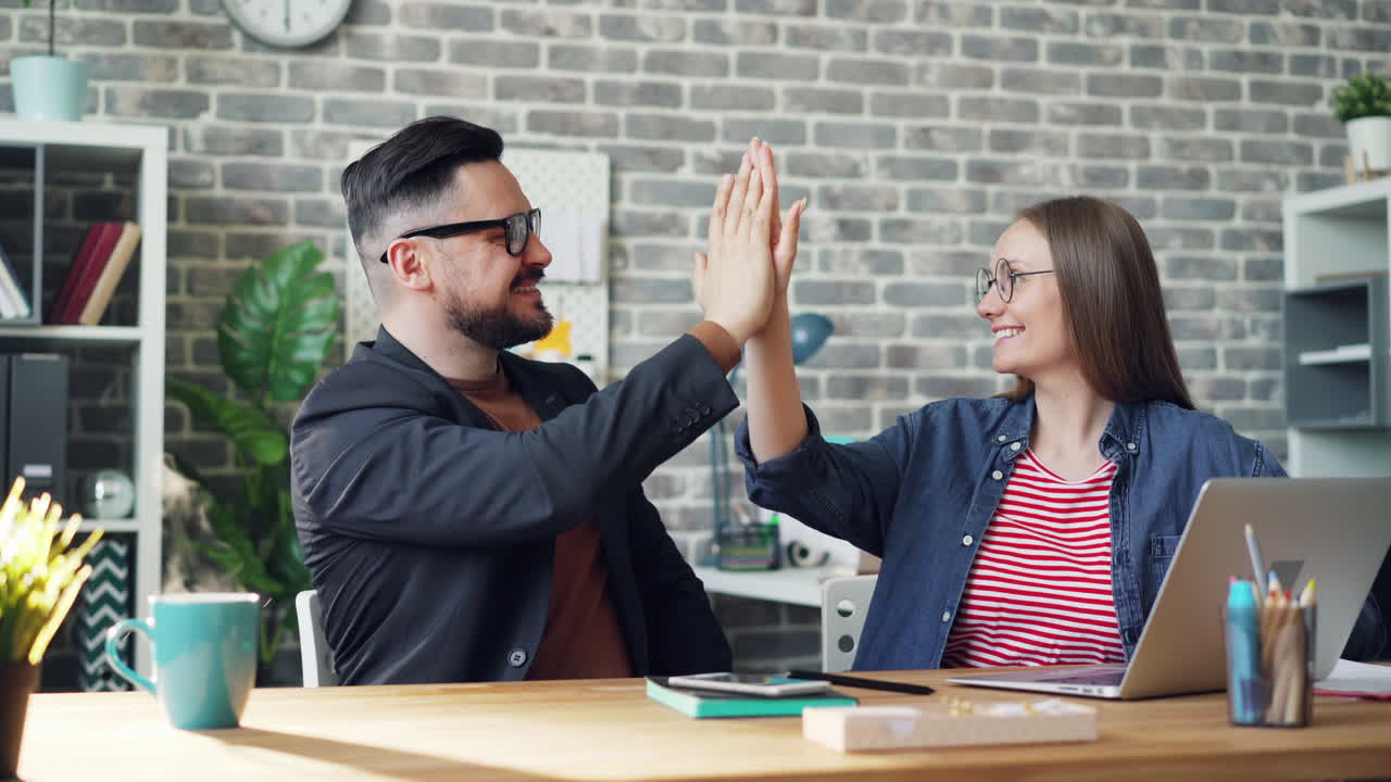 Happy Colleagues High-Fiving