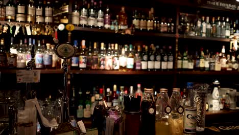 bartender mixing and serving a drink at bar