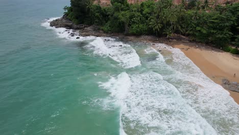 ocean waves crashing on surin beach phuket thailand