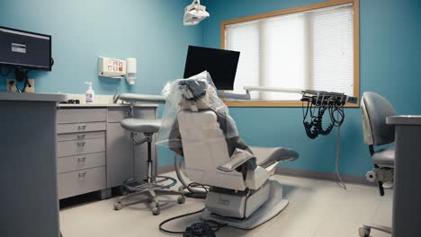 wide push in shot of a dental office or teeth cleaning room