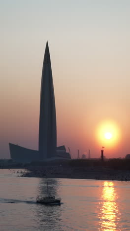 sunset over the river with skyscraper