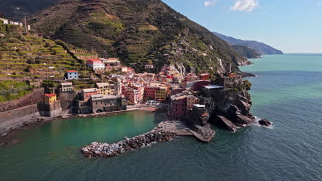 Vernazza, Cinque Terre, Italy with coastal view, colorful buildings, and lush hillsides