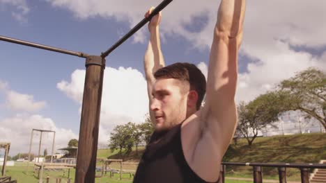 young man training at an outdoor gym bootcamp