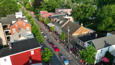 family and friends gather to watch parade in small town usa