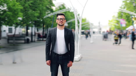 man standing in city street