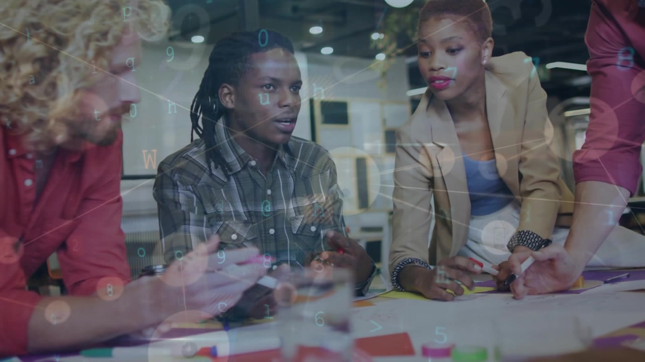 Diverse Creative Team Collaborating on Project in Modern Office