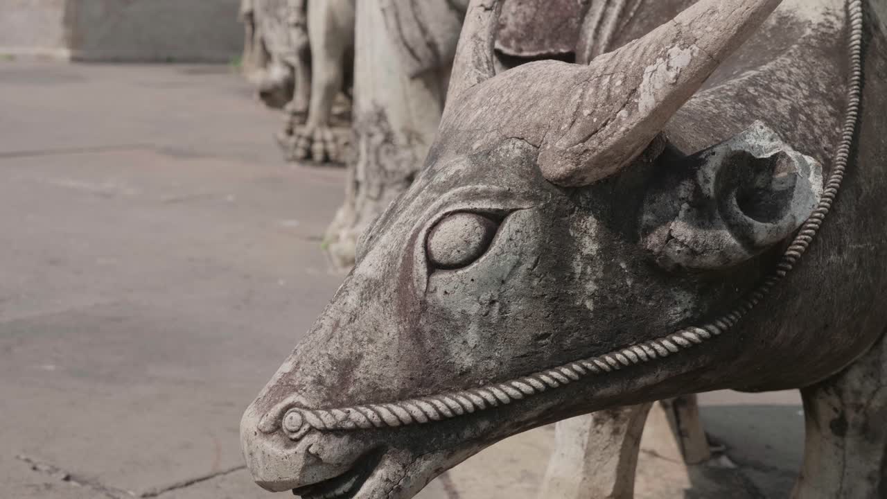 Rising Shot of Ox Statue on the Courtyard of a Temple. 4K Slow Motion.