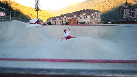 skater performing tricks at mountain resort skatepark