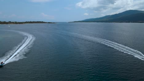 low water drone clip of a jetski and a boat in the bay of vourvourou, halkidiki, northern greece