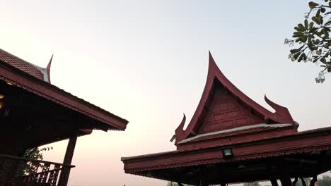 traditional thai house with tree and sky