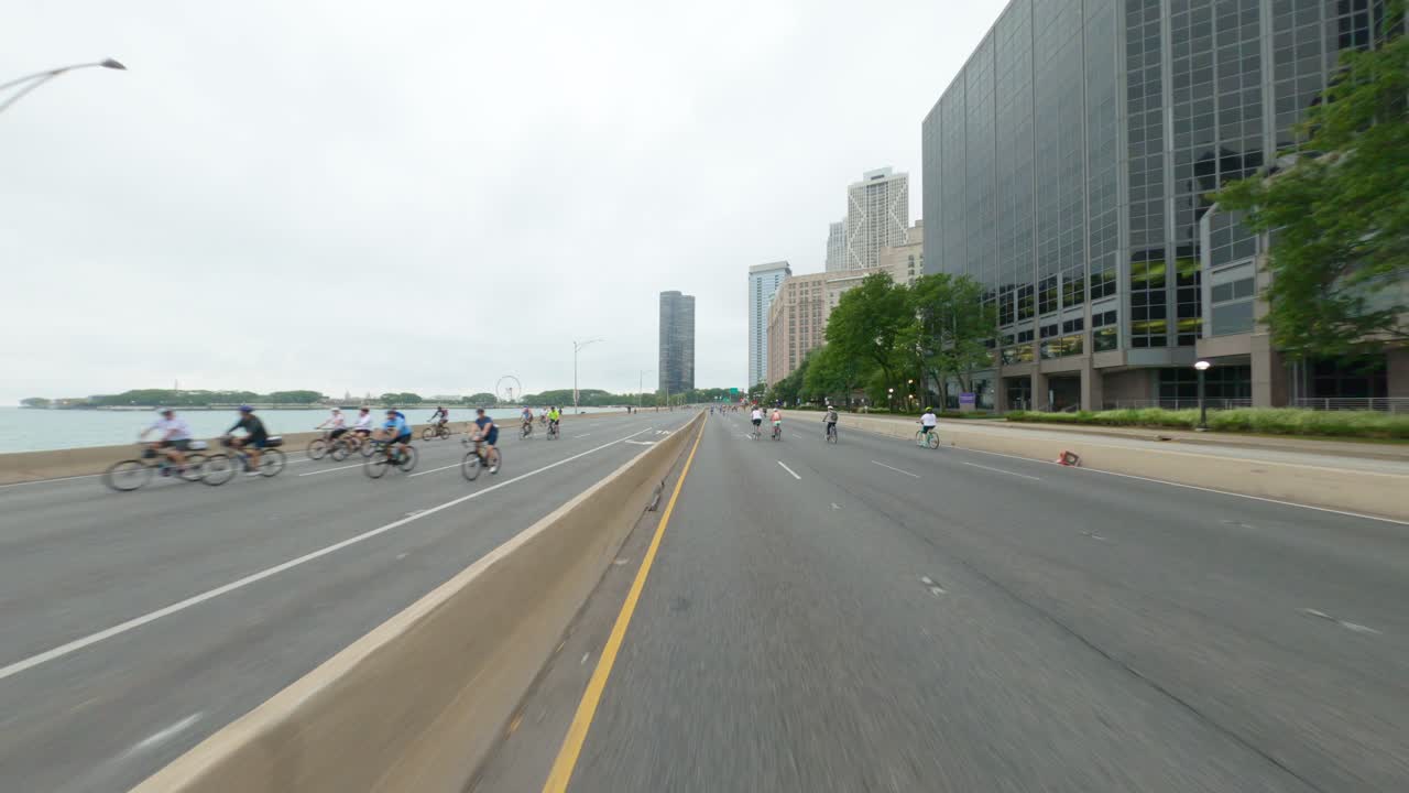 Chicago cyclists riding southbound on DuSable Lake Shore Drive during Bike the Drive 2022 ferris wheel from navy pier