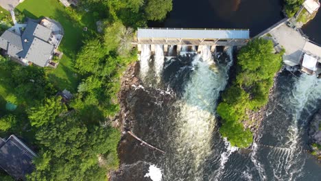 Spill-way-controlling-water-level-to-prevent-floods,-birds-eye-view