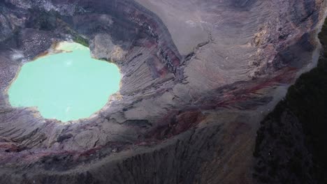 aerial orbits steaming hot crater lake in el salvador volcano caldera