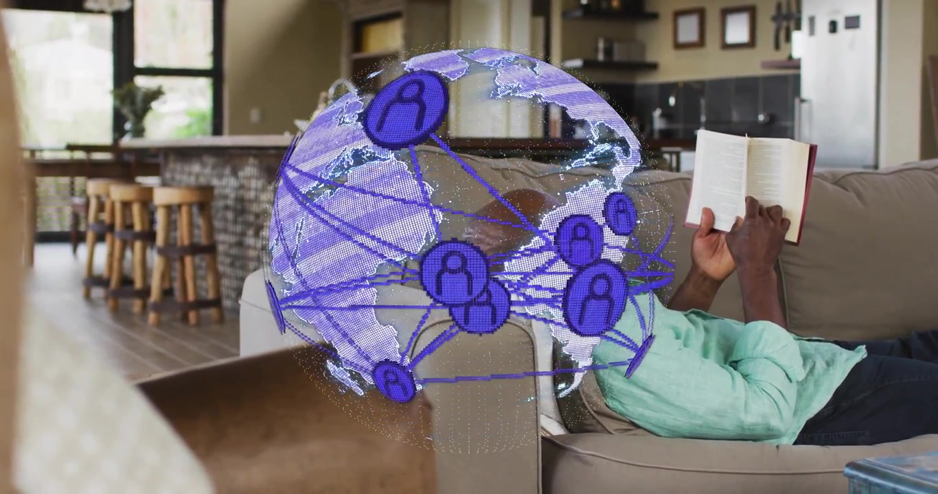 Senior man reading book causing violet-blue globe animating nodes rotating, showing digital network
