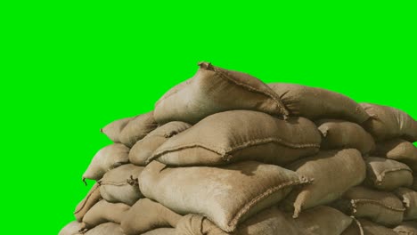 sandbags-for-flood-defense-or-military-use-on-green-chromakey-background