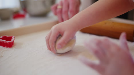 boy shapes dough close up