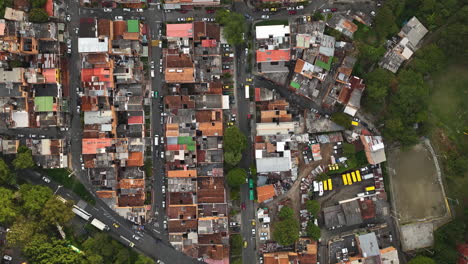 Aerial-view-rising-over-the-Commune-13-slums-of-Medellin,-Colombia---Birds-eye,-drone-shot