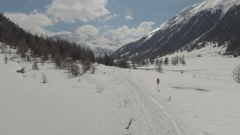 ski tour and cross-country ski routes in livigno, italy in direction to passo forcola