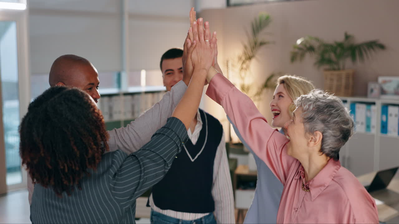 Diverse business team celebrating success with a high five