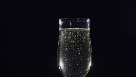 sparkling white wine or cava or prosecco in champagne glass with bubbles sparkling white wine or cava or prosecco in champagne glass with bubbles
