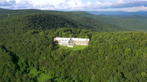 mansion building estate on scenic overlook in appalachian mountains, aerial