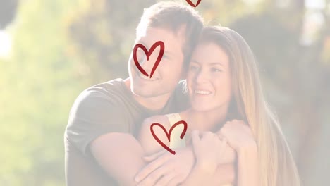 Animation-of-red-hearts-over-caucasian-couple-smiling-and-embracing