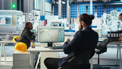 photovoltaics factory engineer taking notes after adjusting system parameters