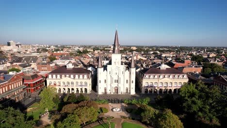 a panoramic zoom-out captures a person walking in jackson square, new orleans